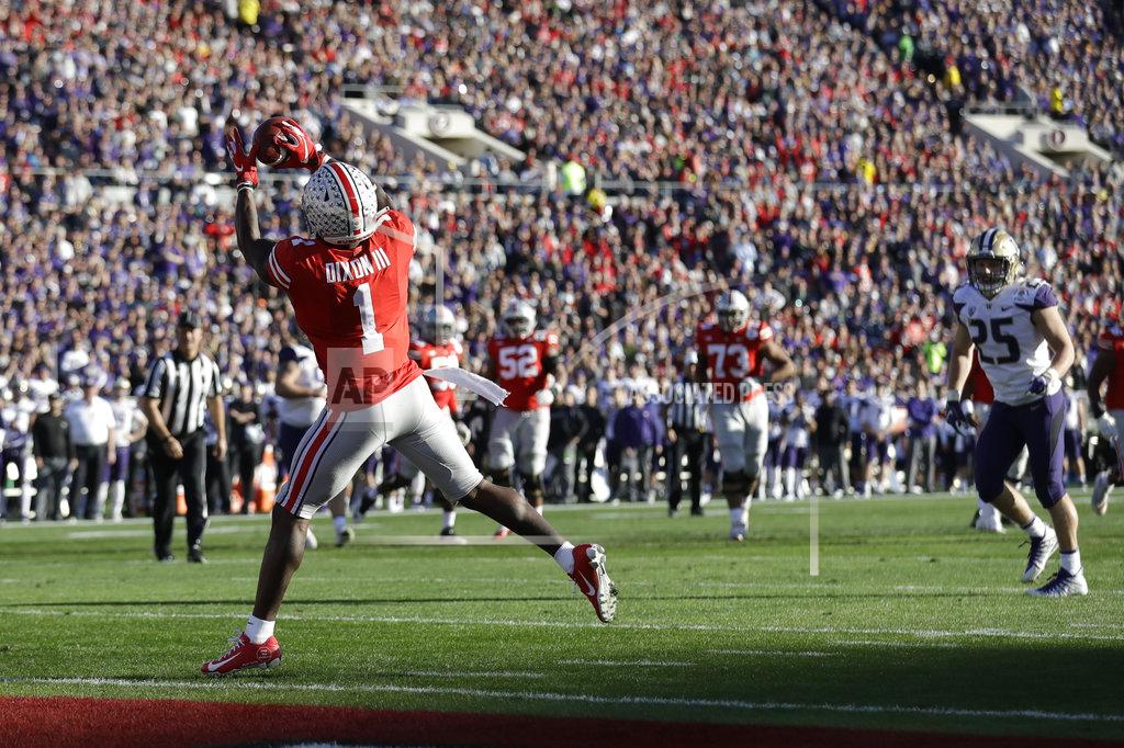 Marcio Jose Sanchez Ohio State wide receiver Johnnie Dixon (1) catches a pass for a touchdown against Washington during the first half of the Rose Bowl NCAA college football game Tuesday, Jan. 1, 2019, in Pasadena, Calif. (AP Photo/Marcio Jose Sanchez)