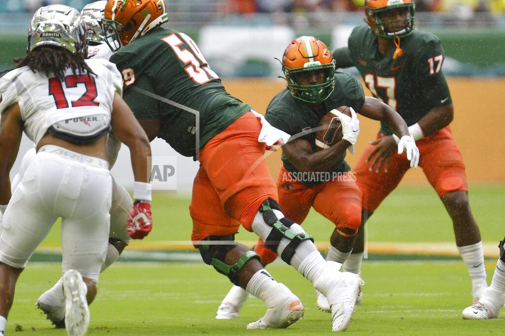 Jim Rassol Florida A&M running back Bishop Bonnett (1) finds running room against Jackson State in the first quarter of an NCAA college football game, Sunday, Sept. 5, 2021, in Miami Gardens, Fla. (AP Photo/Jim Rassol)
