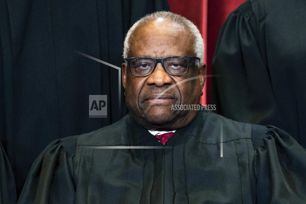 Erin Schaff FILE - Justice Clarence Thomas sits during a group photo at the Supreme Court in Washington, on Friday, April 23, 2021. Supreme Court justices have long prized confidentiality. It's one of the reasons the leak of a draft opinion in a major abortion case last week was so shocking. But it's not just the justices' work on opinions that they understandably like to keep under wraps. The justices are also ultimately the gatekeepers to information about their travel, speaking engagements and health issues. (Erin Schaff/The New York Times via AP, Pool, File)