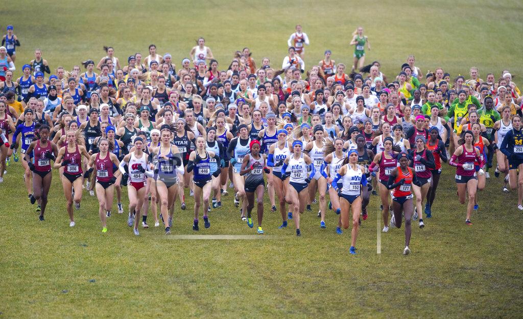 Doug Mcschooler FILE - Runners compete in the women's NCAA Division I Cross-Country Championships, Saturday, Nov. 23, 2019, in Terre Haute, Ind. The number of women competing at the highest level of college athletics continues to rise along with an increasing funding gap between men’s and women’s sports programs, according to an NCAA report examining the 50th anniversary of Title IX. (AP Photo/Doug McSchooler, File)