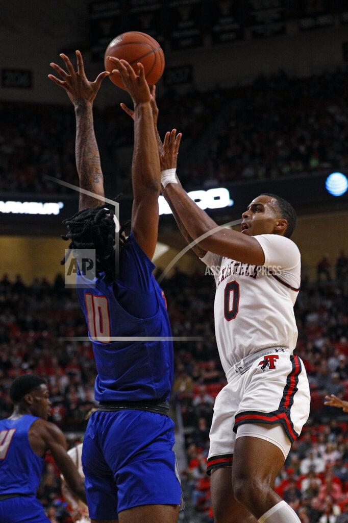 Brad Tollefson Texas Tech's Kyler Edwards (0) shoots the ball over Tennessee State's Shakem Johnson (10) during the first half of an NCAA college basketball game Thursday, Nov. 21, 2019, in Lubbock, Texas. (AP Photo/Brad Tollefson)
