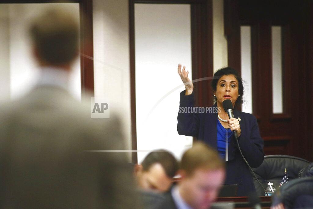 Phil Sears At right, Rep. Daisy Morales, D-Orlando, asks a question of Rep. Jay Trumbull, R-Panama City, left, about his bill titled CS/SB 2-D: Property Insurance in the Florida House of Representatives, Wednesday, May 25, 2022, at the Capitol in Tallahassee, Fla. (AP Photo/Phil Sears)
