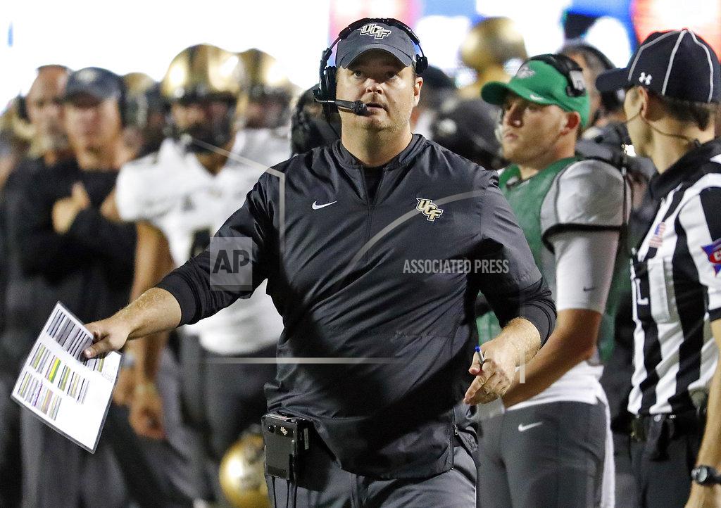 Karl B Deblaker Central Florida head coach Josh Heupel watches a replay on the scoreboard during the first half of an NCAA college football game against East Carolina in Greenville, N.C., Saturday, Oct. 20, 2018. (AP Photo/Karl B DeBlaker)