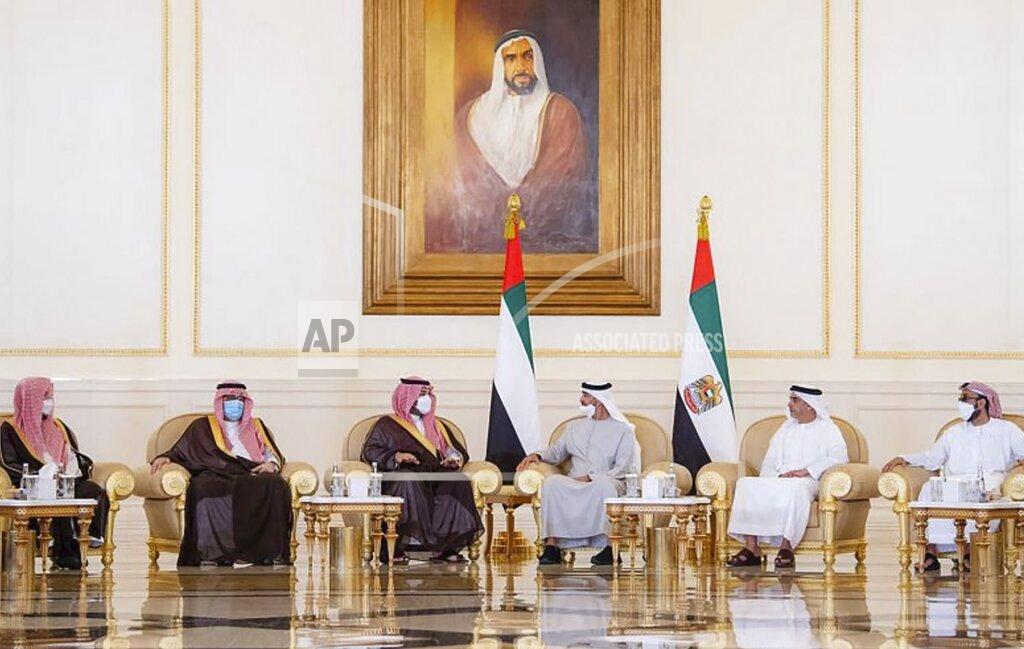 Uncredited In this photo released by Saudi Press Agency, Saudi Crown Prince Mohammed bin Salman, third left, offers condolences to Sheikh Mohamed bin Zayed Al Nahyan, president of the UAE and ruler of Abu Dhabi, third, right, on the passing of Sheikh Khalifa bin Zayed Al Nahyan, the late president of the UAE, at the Presidential Airport in Abu Dhabi, UAE, Monday, May 16, 2022. (Saudi Press Agency via AP)