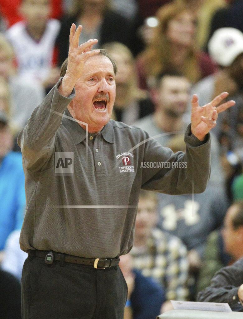 Charles Fox FILE - In this Feb. 3, 2015, file photo, Philadelphia University's Herb Magee gestures during the team's game against Wilmington in Philadelphia. Magee joined Duke coach Mike Krzyzewski as the only NCAA men's coaches to win 1,100 basketball games. Krzyzewski has 1,138 wins (1,065 with Duke) in a career that started with Army in 1975. Magee hit the magic number this week when Jefferson University (the new name for Philadelphia University) beat Kutztown 98-79 in front of maybe 1,000 fans at home on Henry Avenue. (Charles Fox/The Philadelphia Inquirer via AP, File)