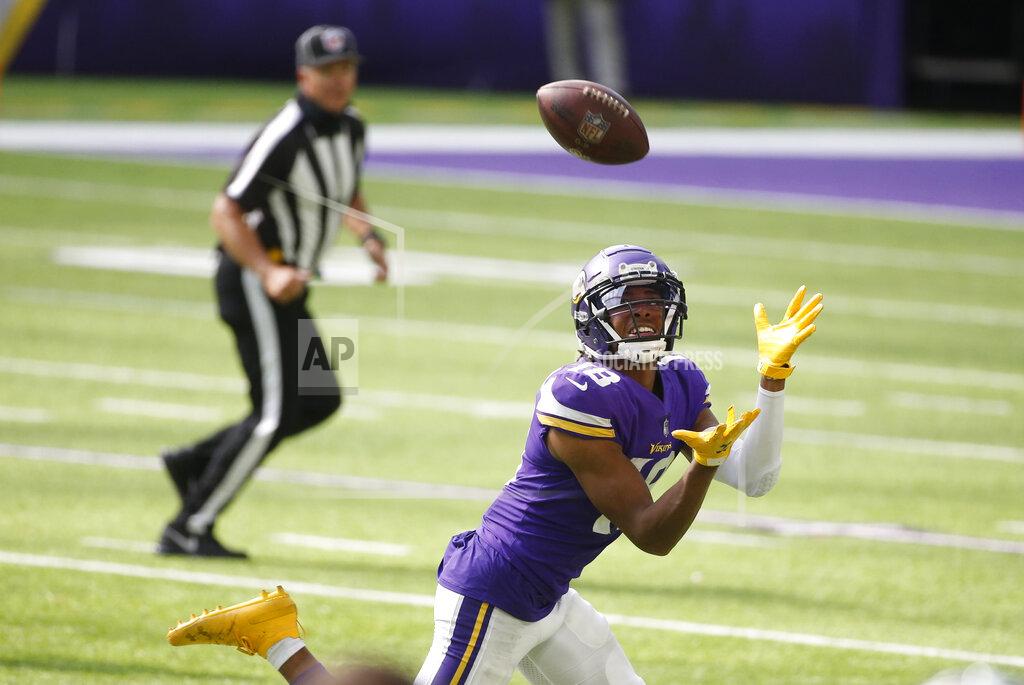 Bruce Kluckhohn Minnesota Vikings wide receiver Justin Jefferson catches a 71-yard touchdown pass during the second half of an NFL football game against the Tennessee Titans, Sunday, Sept. 27, 2020, in Minneapolis. (AP Photo/Bruce Kluckhohn)