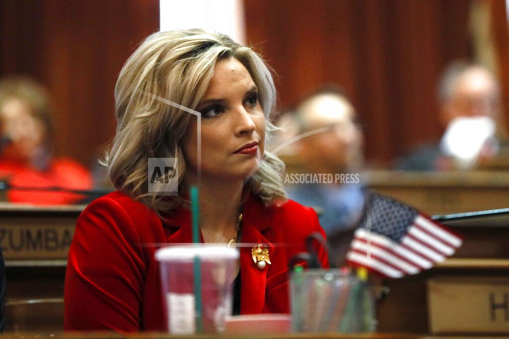 Charlie Neibergall FILE - In this Jan. 13, 2020, file photo, State Rep. Ashley Hinson, R-Marion, watches as House Speaker Pat Grassley takes the oath of office during the opening day of the Iowa Legislature, at the Statehouse in Des Moines, Iowa. Hinson is an Iowa Republican candidate for congress Nov. 3, 2020. (AP Photo/Charlie Neibergall, File)