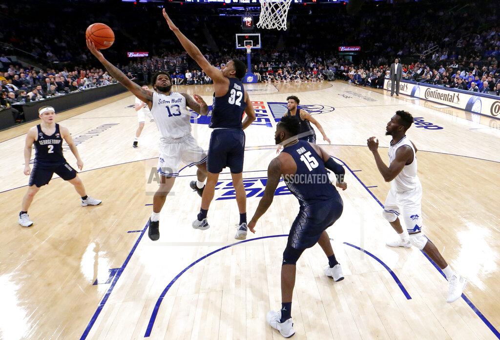 Julio Cortez Seton Hall guard Myles Powell (13) goes up for a shot against Georgetown guard Kaleb Johnson (32) during the second half of an NCAA college basketball game in the Big East men's tournament, Thursday, March 14, 2019, in New York. Seton Hall won 73-57. (AP Photo/Julio Cortez)