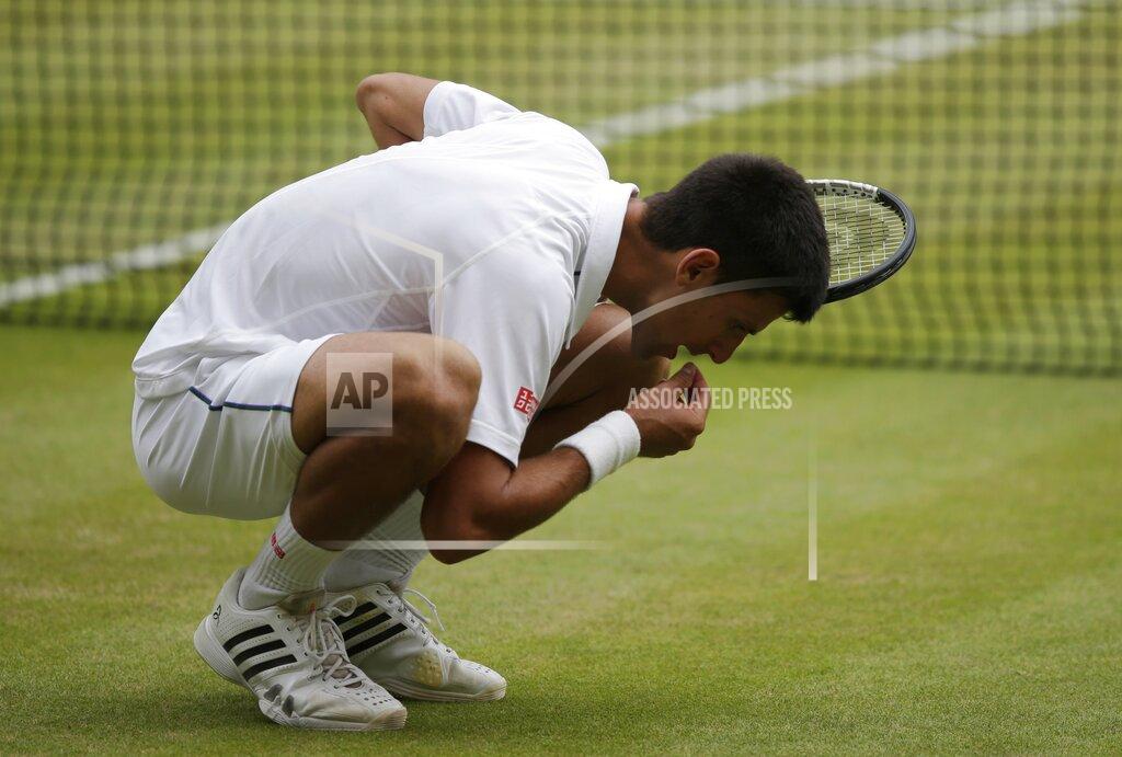 Pavel Golovkin FILE - In this July 12, 2015, file photo, Novak Djokovic of Serbia celebrates winning the men's singles final against Roger Federer of Switzerland at the All England Lawn Tennis Championships in Wimbledon, London. Djokovic won the match 7-6, 6-7, 6-4, 6-3. (AP Photo/Pavel Golovkin, File)