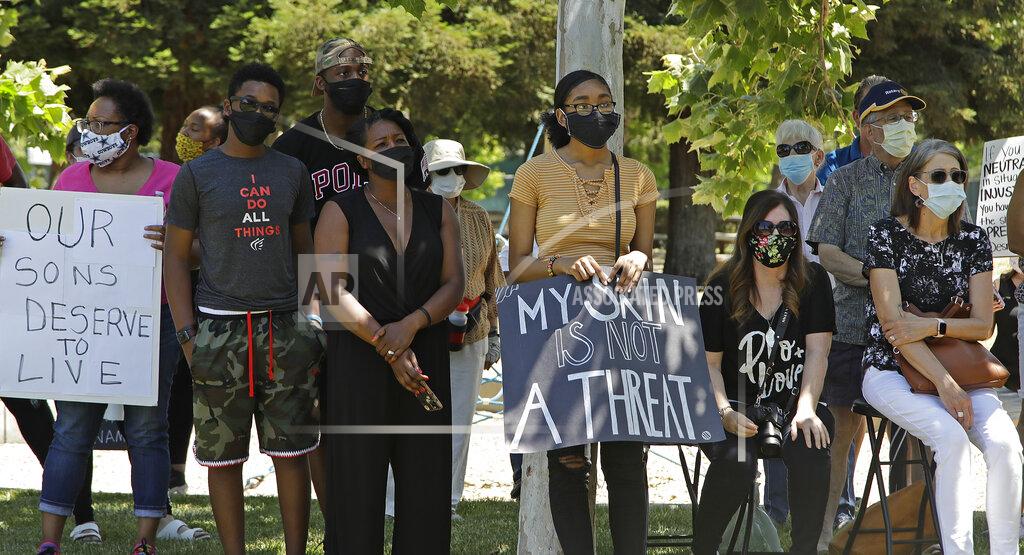 Ben Margot People attending the "Taking a knee for Justice and Prayer" service listen to the sermon of pastors on Wednesday, June 3, 2020, in Fairfield, Calif. (AP Photo/Ben Margot)