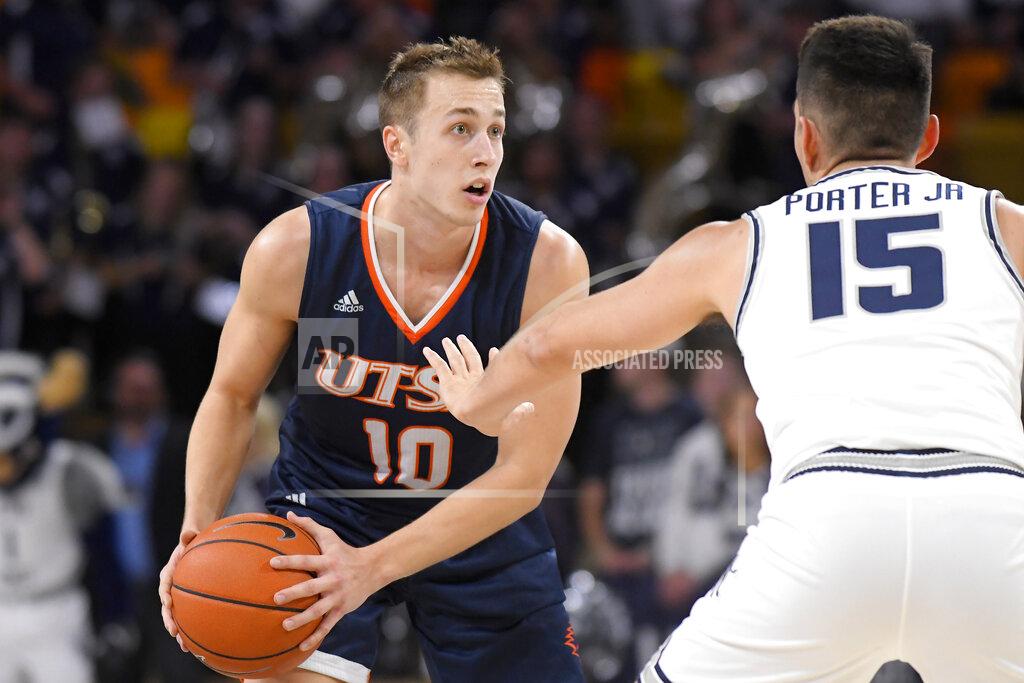 Eli Lucero UTSA guard Erik Czumbel (10) looks to dribble the ball as Utah State guard Abel Porter (15) defends during the first half of an NCAA college basketball game Monday, Nov. 18, 2019, in Logan, Utah. (AP Photo/Eli Lucero)