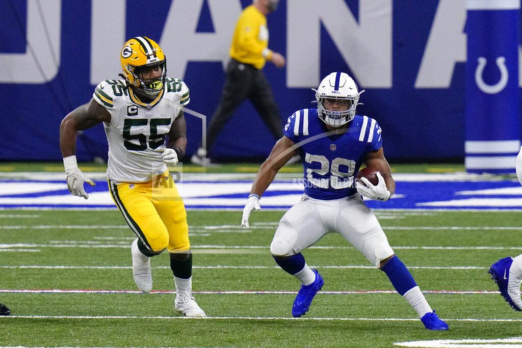 Aj Mast Indianapolis Colts' Jonathan Taylor (28) is chased by Green Bay Packers' Za'Darius Smith (55) during the second half of an NFL football game, Sunday, Nov. 22, 2020, in Indianapolis. (AP Photo/AJ Mast)