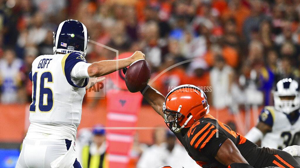 David Dermer Cleveland Browns defensive end Myles Garrett, right, knocks the ball loose from Los Angeles Rams quarterback Jared Goff for a fumble during the first half of an NFL football game, Sunday, Sept. 22, 2019, in Cleveland. (AP Photo/David Dermer)
