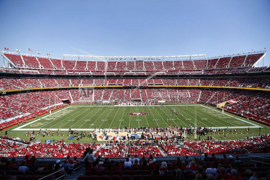 Tony Avelar FILE - In this Oct. 7, 2018, file photo, fans watch an NFL football game between the San Francisco 49ers and the Arizona Cardinals at Levi's Stadium in Santa Clara, Calif. With the College Football Playoff title game located thousands of miles away from the two campuses in Alabama and South Carolina, possible fatigue for fan bases of teams that have become annual participants in the playoff and a game site in an expensive market lacking college football die-hards, prices for tickets for Monday night's championship game in Santa Clara have been plummeting the past few days. (AP Photo/Tony Avelar)