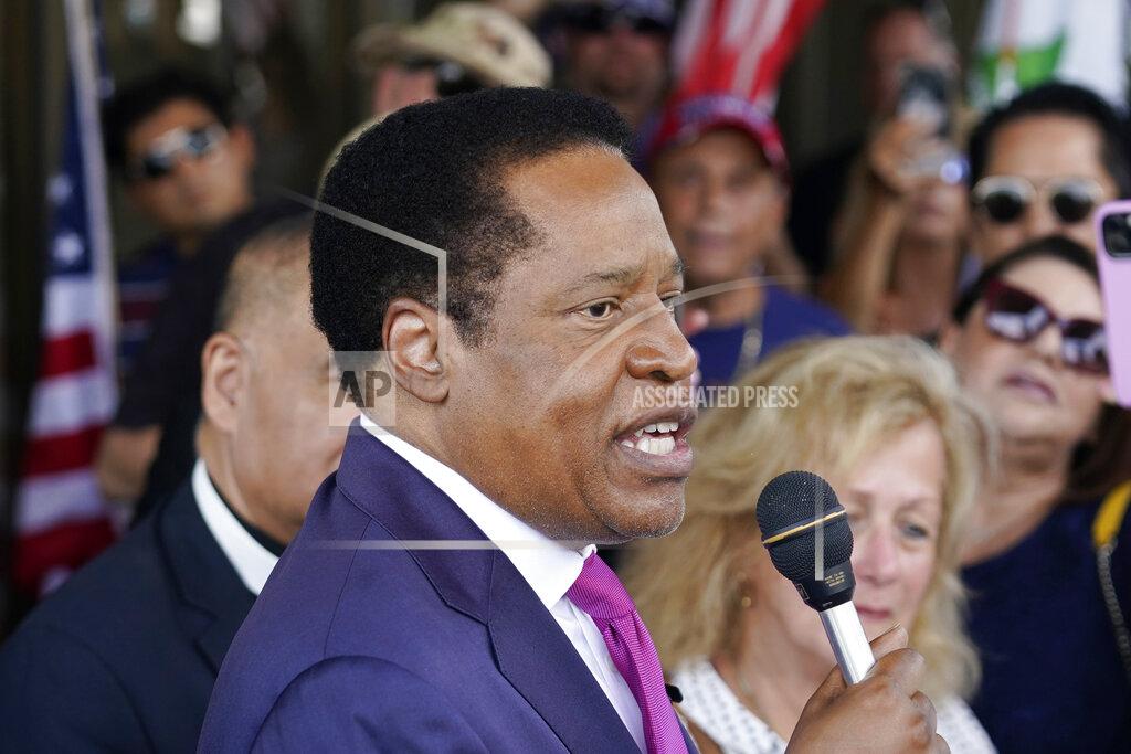 Marcio Jose Sanchez FILE - In this July 13, 2021, file photo, gubernatorial candidate and radio talk show host Larry Elder speaks to supporters during a campaign stop in Norwalk, Calif. In two short months, Larry Elder emerged from the province of conservative talk radio to dominate the Republican field in the California recall election that could remove Democratic Gov. Gavin Newsom from office, drawing national headlines, attracting fervent crowds to his rallies and quickly banking millions of dollars for his first campaign. (AP Photo/Marcio Jose Sanchez, File)