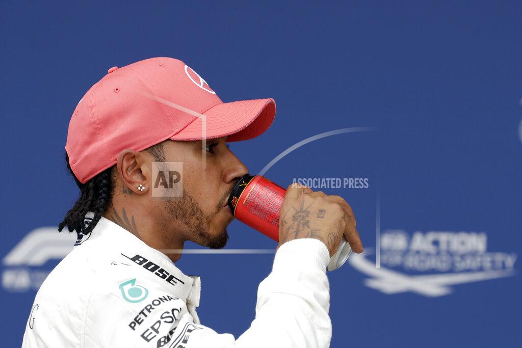 Luca Bruno Second placed Mercedes driver Lewis Hamilton of Britain refreshes after the qualifying session at the Silverstone racetrack, in Silverstone, England, Saturday, July 13, 2019. The British Formula One Grand Prix will be held on Sunday. (AP Photo/Luca Bruno)