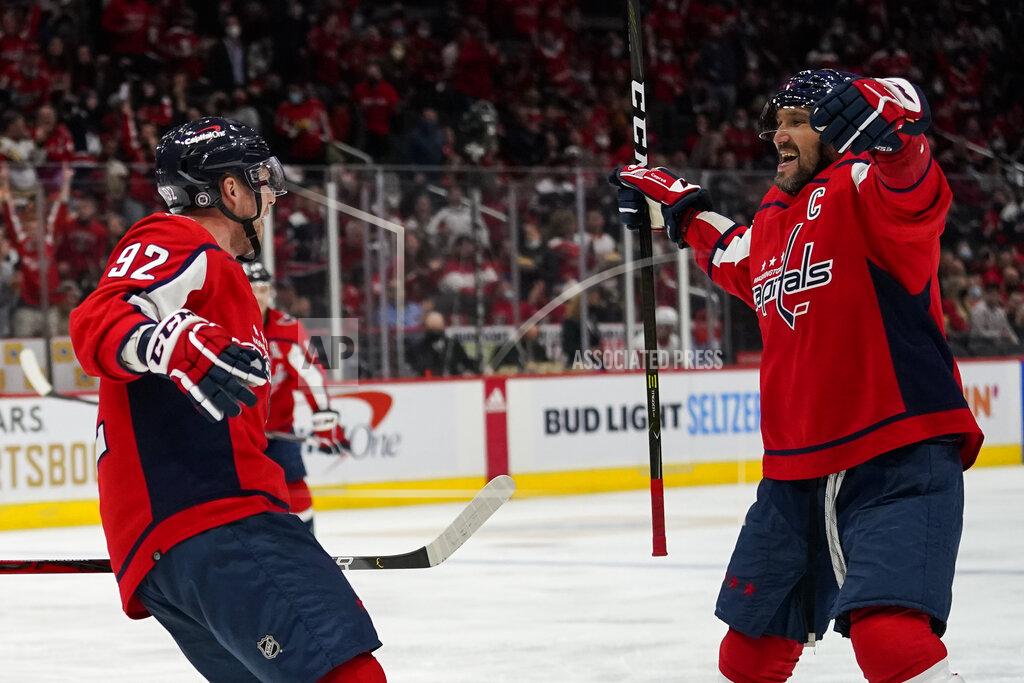 Alex Brandon Washington Capitals center Evgeny Kuznetsov, left, celebrates his goal with left wing Alex Ovechkin in the second period of an NHL hockey game against the Detroit Red Wings, Wednesday, Oct. 27, 2021, in Washington. (AP Photo/Alex Brandon)