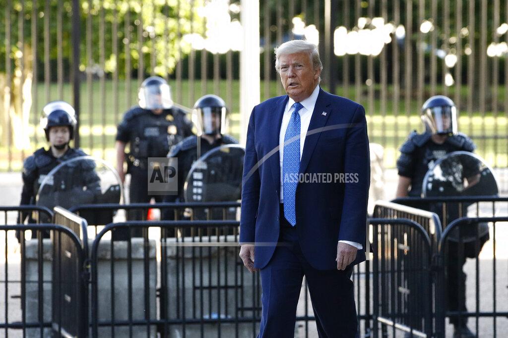 Patrick Semansky President Donald Trump walks in Lafayette Park to visit outside St. John's Church across from the White House Monday, June 1, 2020, in Washington. Part of the church was set on fire during protests on Sunday night. (AP Photo/Patrick Semansky)