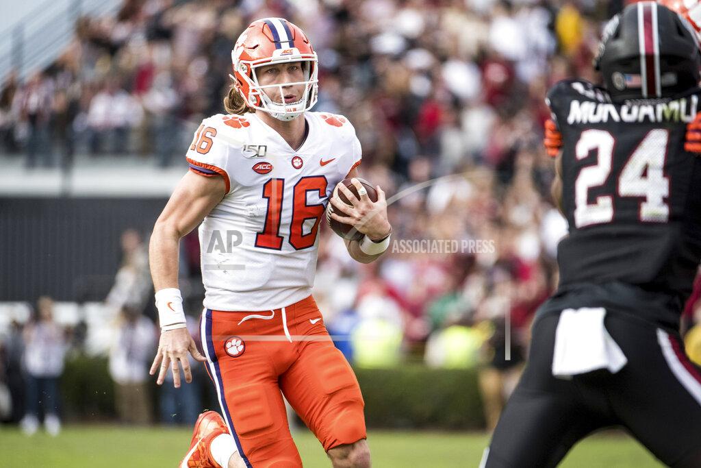 Sean Rayford Clemson quarterback Trevor Lawrence (16) carries the ball against South Carolina during the first half of an NCAA college football game Saturday, Nov. 30, 2019, in Columbia, S.C. (AP Photo/Sean Rayford)