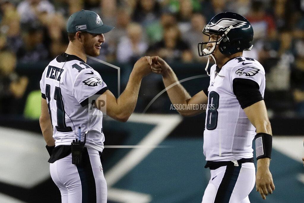 Michael Perez Philadelphia Eagles' Carson Wentz, left, reacts with Josh McCown during the first half of a preseason NFL football game against the Baltimore Ravens, Thursday, Aug. 22, 2019, in Philadelphia. (AP Photo/Michael Perez)