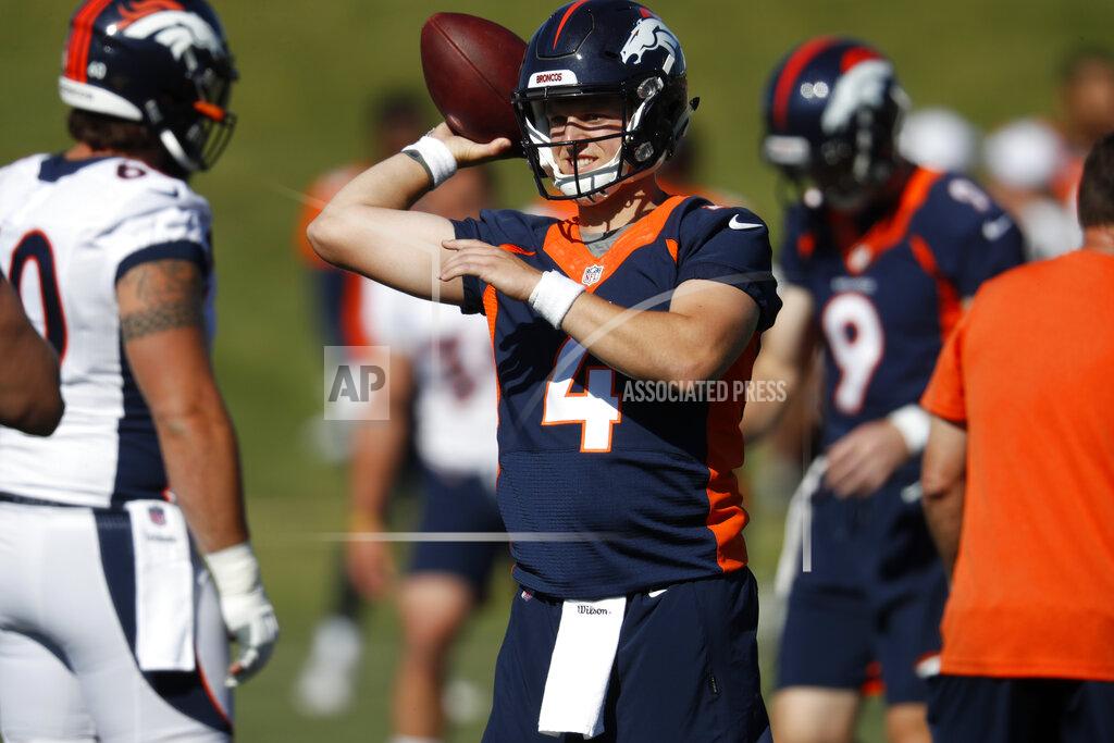 Denver Broncos quarterback Brett Rypien looks to pass the ball during drills at the team's NFL football training camp Friday, July 19, 2019, in Englewood, Colo. (AP Photo/David Zalubowski)