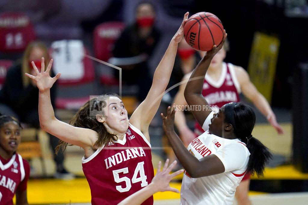 Julio Cortez FILE - Indiana forward Mackenzie Holmes (54) blocks a shot by Maryland guard Ashley Owusu during the second half of an NCAA college basketball game in College Park, Md., in this Monday, Jan. 4, 2021, file photo. This week, No. 9 Indiana begins a new quest — dethroning No. 7 Maryland as tourney champs in Indianapolis. (AP Photo/Julio Cortez, File)