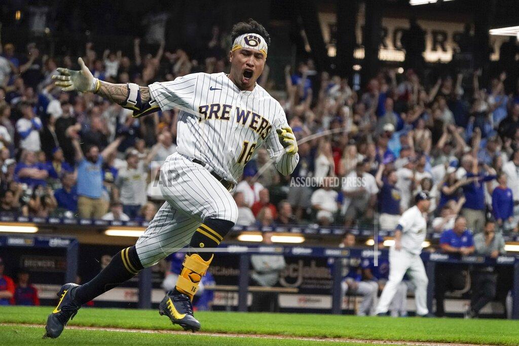 Morry Gash Milwaukee Brewers' Kolten Wong reacts after hitting a two-run scoring single during the eighth inning of a baseball game against the Chicago Cubs Friday, Sept. 17, 2021, in Milwaukee. (AP Photo/Morry Gash)