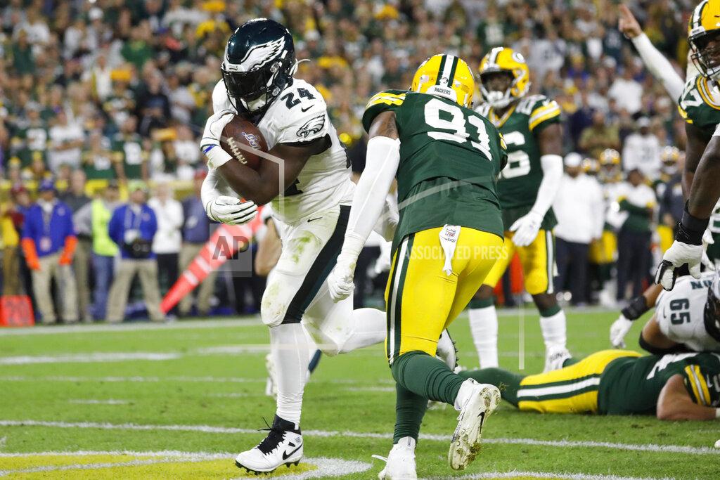 Jeffrey Phelps Philadelphia Eagles running back Jordan Howard rushes for a touchdown past Green Bay Packers outside linebacker Preston Smith (91) during the first half of an NFL football game Thursday, Sept. 26, 2019, in Green Bay, Wis. (AP Photo/Jeffrey Phelps)