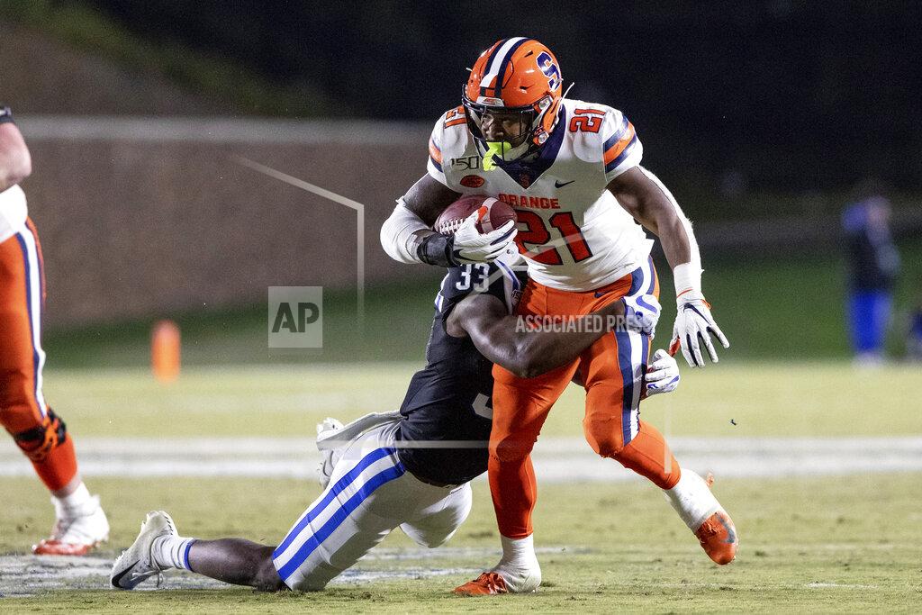 Ben Mckeown Syracuse's Moe Neal (21) carries the ball as Duke's Leonard Johnson (33) attempts a tackle during the second half of an NCAA college football game in Durham, N.C., Saturday, Nov. 16, 2019. (AP Photo/Ben McKeown)