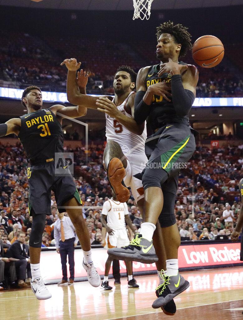 Eric Gay Baylor forward Freddie Gillespie, right, scrambles for a rebound over Texas forward Royce Hamm Jr. (5) during the second half of an NCAA college basketball game, Monday, Feb. 10, 2020, in Austin, Texas. (AP Photo/Eric Gay)