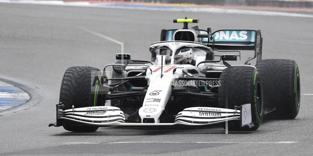 Jens Meyer Mercedes driver Valtteri Bottas of Finland steers his car during the German Formula One Grand Prix at the Hockenheimring racetrack in Hockenheim, Germany, Sunday, July 28, 2019. (AP Photo/Jens Meyer)