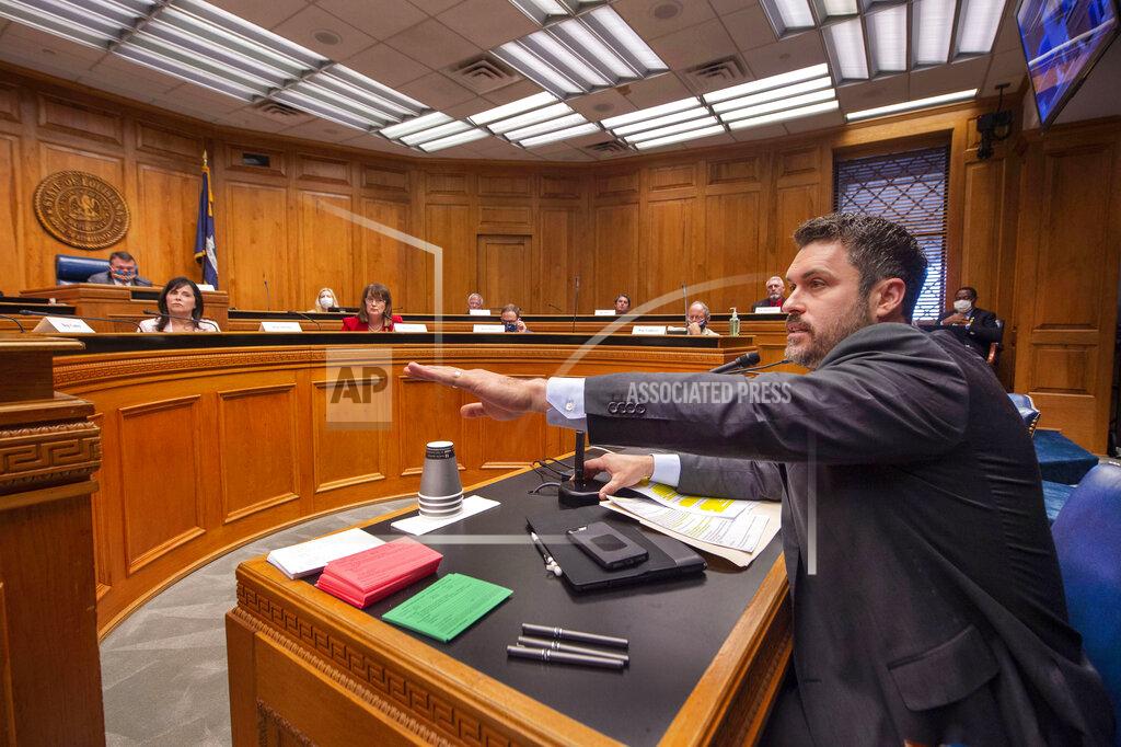 Louisiana House of Representatives Republican Delegation chairman Blake Miguez, R-Erath, speaks in the House and Governmental Affairs committee explaining his House Concurrent Resolution 58, Wednesday, May 6, 2020, at the state Capitol in Baton Rouge, La. Republican lawmakers trying to unravel Louisiana Gov. John Bel Edwards' statewide stay-at-home order began moving legislation Wednesday that would keep the Democratic governor from enforcing the restrictions enacted to combat the coronavirus. (Travis Spradling/The Advocate via AP)