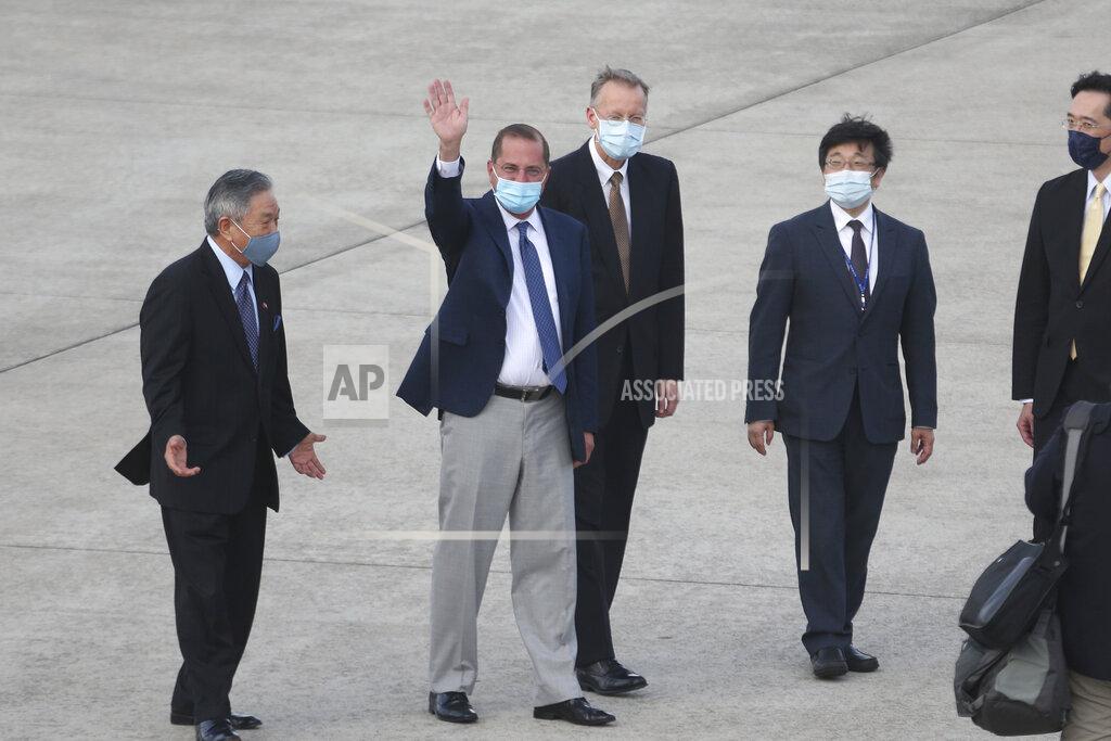 Chiang Ying-Ying U.S. Health and Human Services Secretary Alex Azar, second left, waves to media as he arrives at Taipei Songshan Airport in Taipei, Taiwan, Sunday, Aug. 9, 2020. Azar arrived in Taiwan on Sunday in the highest-level visit by an American Cabinet official since the break in formal diplomatic relations between Washington and Taipei in 1979. (AP Photo/Chiang Ying-ying)