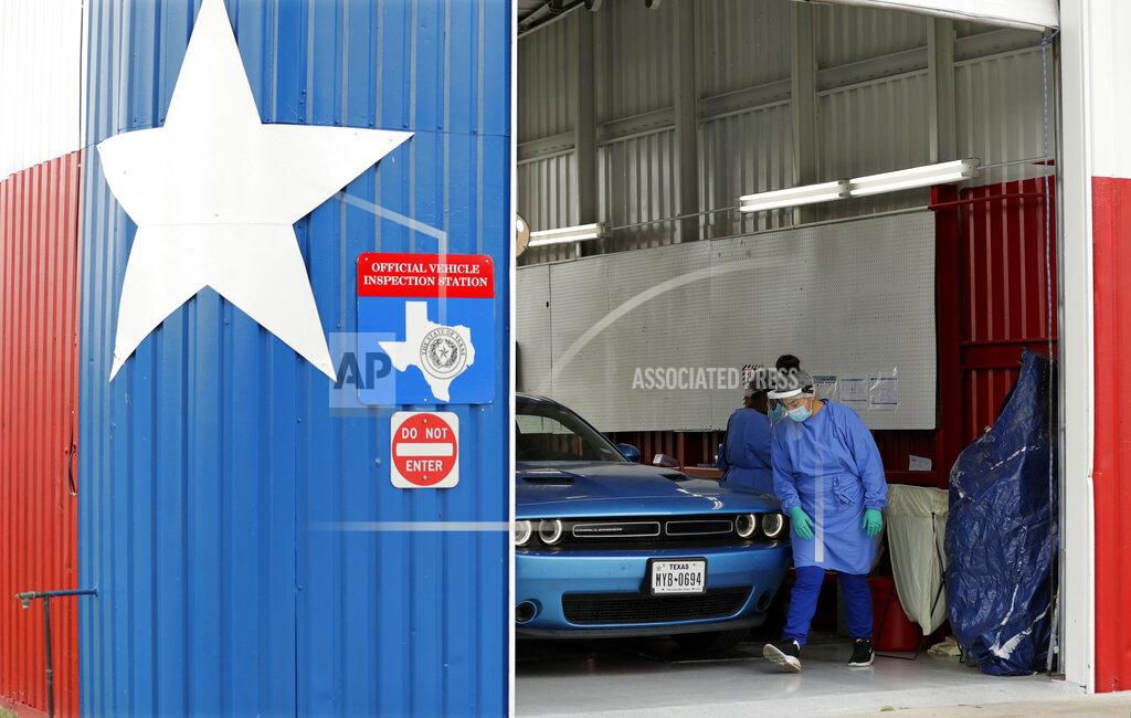 Eric Gay COVID-19 antibody testing and diagnostic testing are administered at a converted vehicle inspection station, Tuesday, July 7, 2020, in San Antonio. Local officials across Texas say their hospitals are becoming increasingly stretched and are in danger of becoming overrun as cases of the coronavirus surge. (AP Photo/Eric Gay)