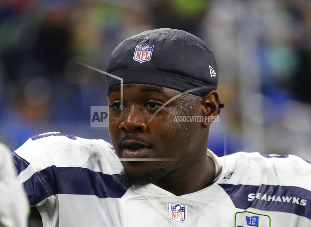 Paul Sancya FILE - In this Oct. 28, 2018, file photo, Seattle Seahawks defensive tackle Jarran Reed watches an NFL football game against the Detroit Lions in Detroit. Reed has been suspended for six games by the NFL for violating the personal conduct policy. He may participate in preseason practices and games, but will not be available to the Seahawks until Oct. 14, 2019. (AP Photo/Paul Sancya, File)