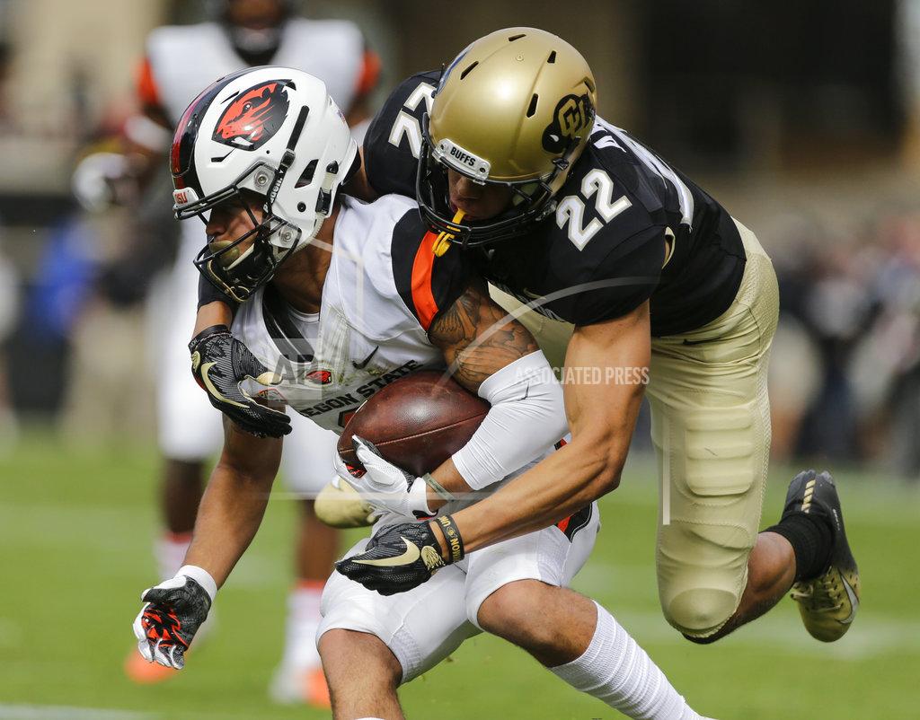 Jack Dempsey Colorado's Daniel Arias (22) tackles Oregon State punt-returner Trevon Bradford (8) during the first half of an NCAA college football game, Saturday, Oct. 27, 2018, in Boulder, Colo. (AP Photo/Jack Dempsey)