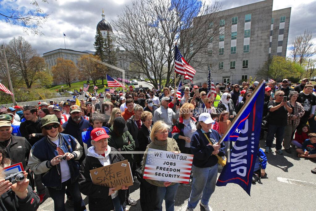 Robert F. Bukaty Protesters rally against the executive orders by Maine Gov. Janet Mills keep some of Maine businesses closed to help prevent the spread of coronavirus, Saturday, May 16, 2020, in Augusta, Maine. (AP Photo/Robert F. Bukaty)