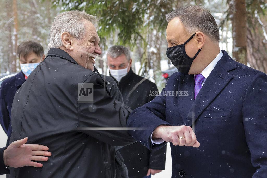 Jakub Szymczuk Poland's President Andrzej Duda touches ellbows with the Czech President Milos Zeman to greet him for for a two-day summit with the presidents of Hungary and The Czech Republic marking 30 years of the Visegrad Group, an informal body of political and economic cooperation in the region, at the presidential residence in the Hel Peninsula, Poland, on Tuesday, Feb. 9, 2021.(Jakub Szymczuk / KPRP via AP )