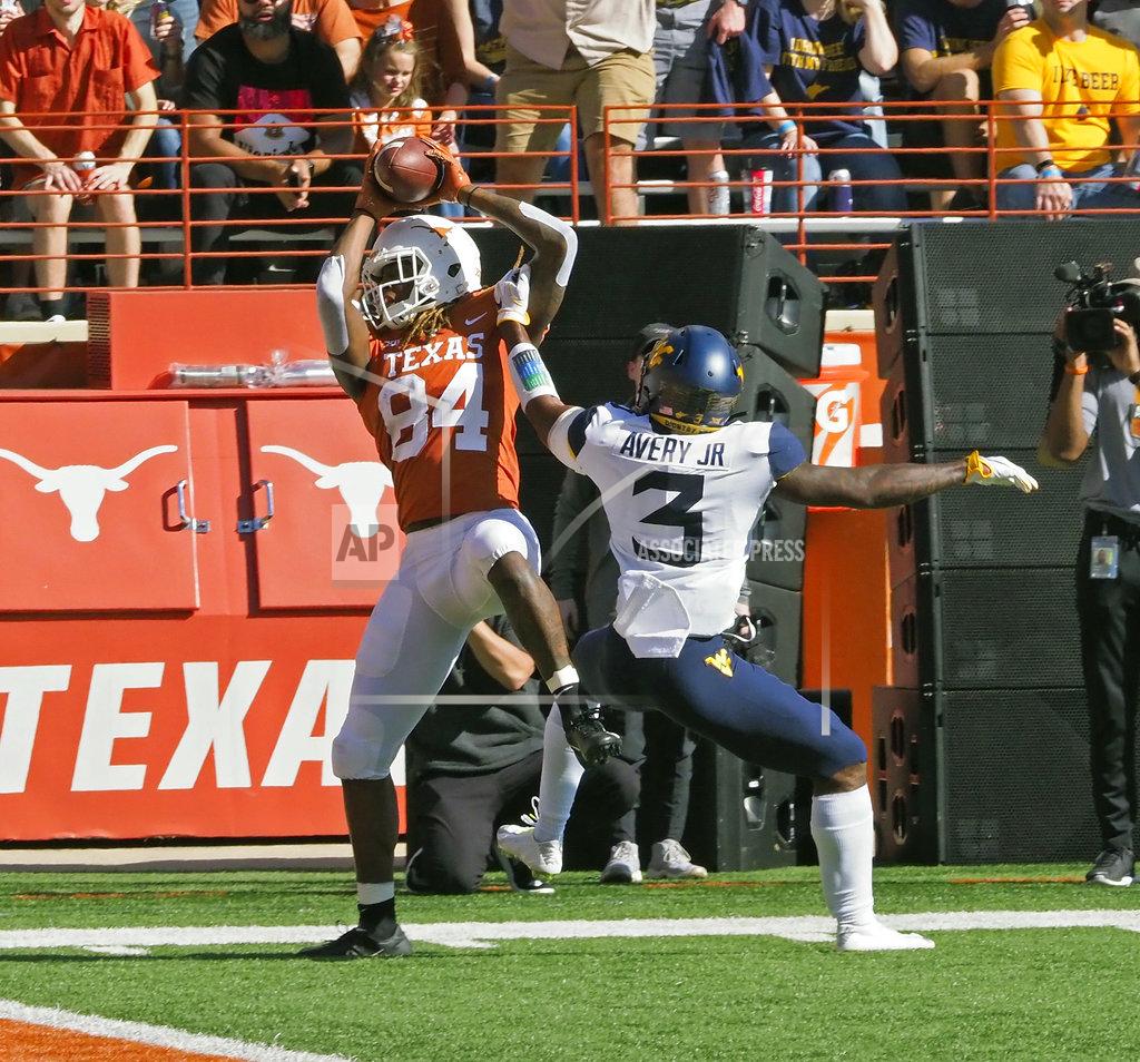 Michael Thomas Texas received Lil'Jordan Humphrey (84) catches the ball at the one-yard line against West Virginia defensive back Toyous Avery, Jr. (3) during the first half of an NCAA college football game, Saturday, Nov. 3, 2018, in Austin, Texas. (AP Photo/Michael Thomas)