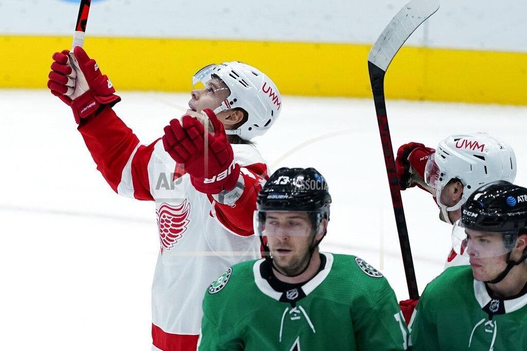 Tony Gutierrez Detroit Red Wings' Vladislav Namestnikov, left, celebrates his goal as Dallas Stars' Mark Pysyk (13) and Miro Heiskanen, right, skate away during the first period of an NHL hockey game in Dallas, Tuesday, Jan. 26, 2021. (AP Photo/Tony Gutierrez)
