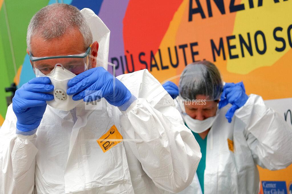 Mauro Scrobogna Volunteer doctors prepare to administer swabs for COVID-19 at a nursing home in Santa Marinella, near Rome, Tuesday, April 21, 2020. Italian Premier Giuseppe Conte on Tuesday confirmed that Italy can start reopening on May 4, but he doused any hopes of a total loosening of some of the strictest lockdown measures in a western democracy. (Mauro Scrobogna/LaPresse via AP)