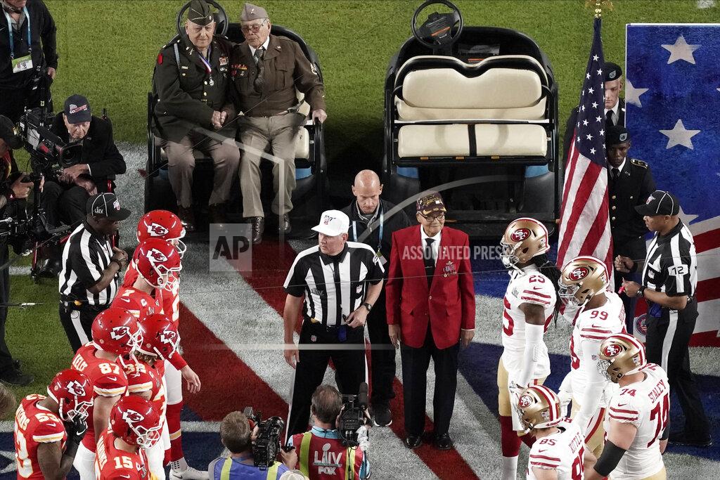 Morry Gash Armed Forces veterans participate during the coin toss before the NFL Super Bowl 54 football game Sunday, Feb. 2, 2020, in Miami Gardens, Fla. (AP Photo/Morry Gash)