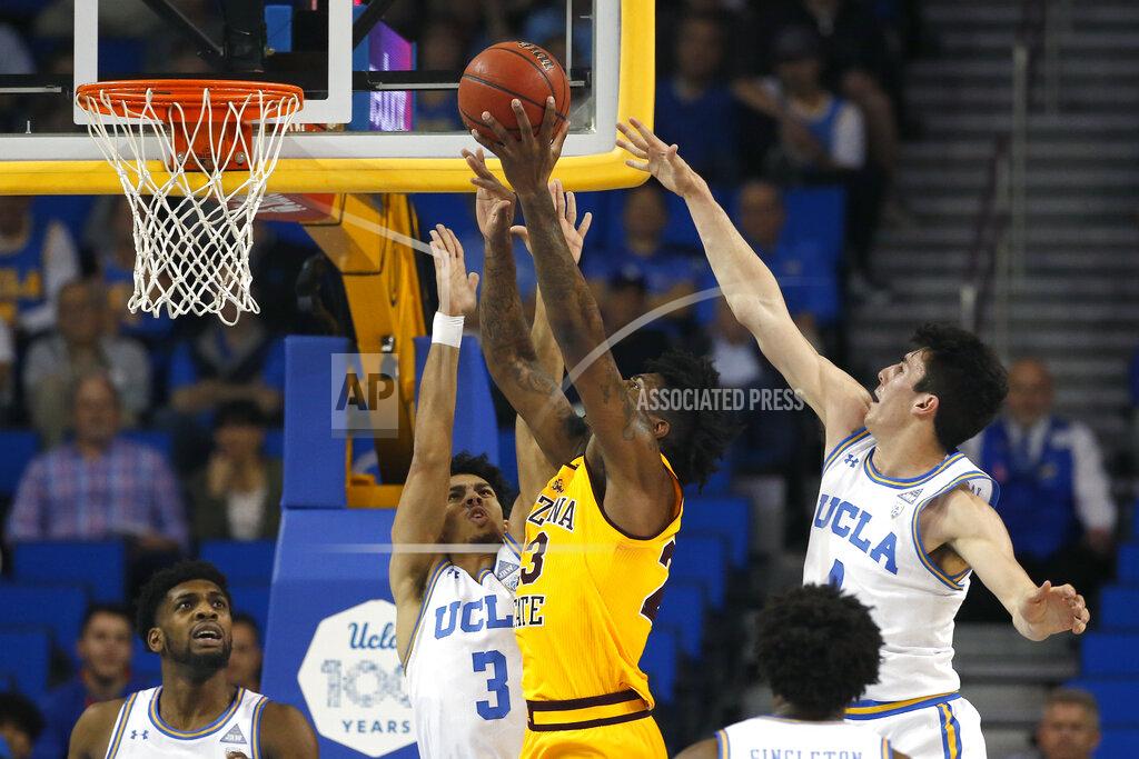 Ringo H.w. Chiu Arizona State forward Romello White, center, shoots under pressure from UCLA guards Jules Bernard (3) and Jaime Jaquez Jr. (4) during the first half of an NCAA college basketball game Thursday, Feb. 27, 2020, in Los Angeles. (AP Photo/Ringo H.W. Chiu)