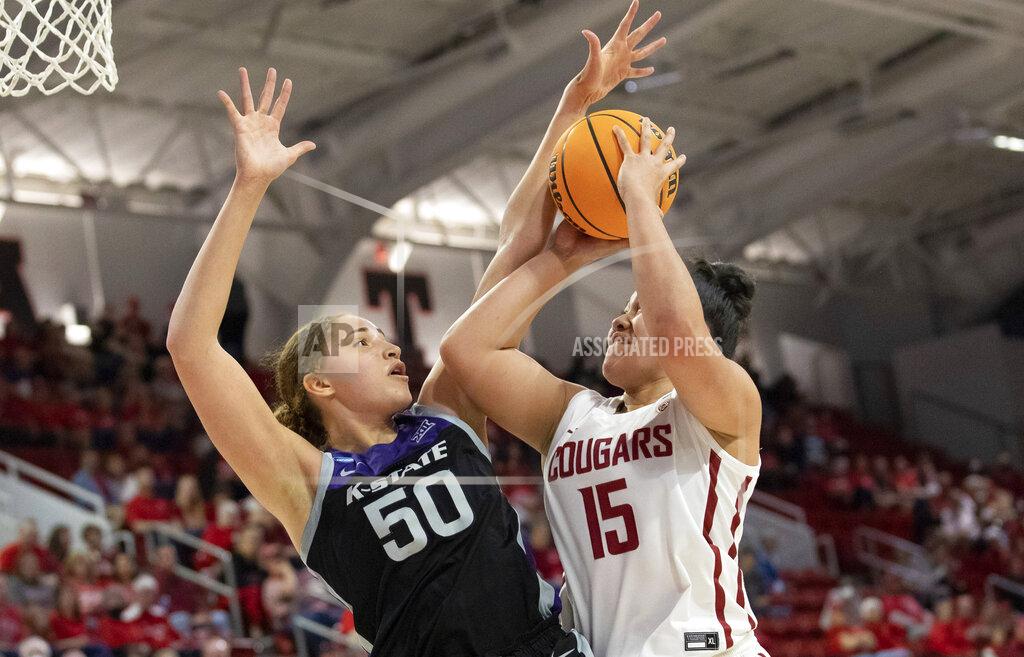 Ben Mckeown Washington State's Ula Motuga (15) attempts a shot as Kansas State's Ayoka Lee (50) defends during the second half of a college basketball game in the first round of the NCAA tournament in Raleigh, N.C., Saturday, March 19, 2022. (AP Photo/Ben McKeown)