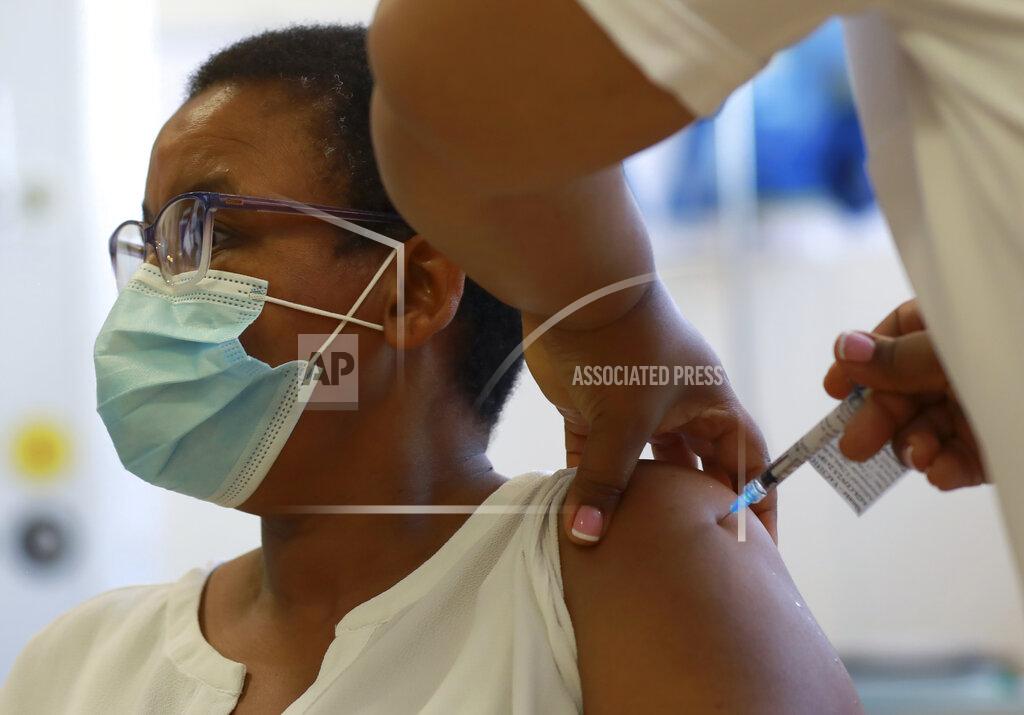 Nardus Engelbrecht A health care worker receives a Johnson and Johnson vaccine at a hospital in Khayelitsha, Cape Town, South Africa Wednesday, Feb. 17, 2021. South African President Cyril Ramaphosa was among the first in his country to receive a COVID-19 vaccination to launch the inoculation drive. (AP Photo/Nardus Engelbrecht)
