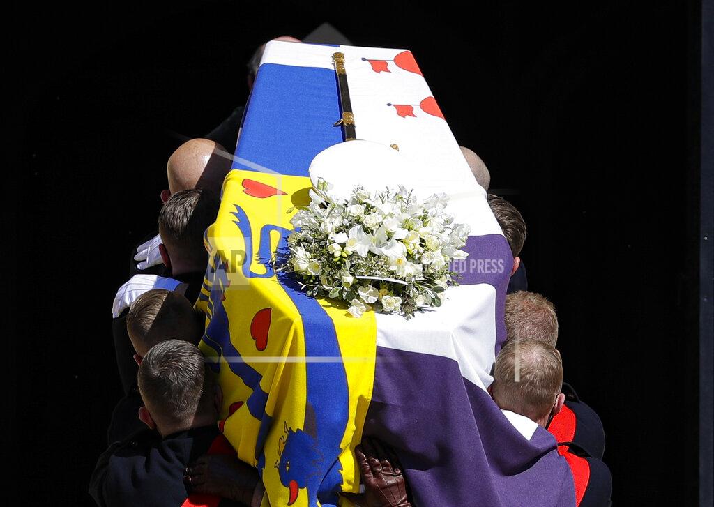Kirsty Wigglesworth The coffin is carried inside the St George's Chapel for the funeral of Britain's Prince Philip inside Windsor Castle in Windsor, England, Saturday, April 17, 2021. (Kirsty Wigglesworth/Pool via AP)