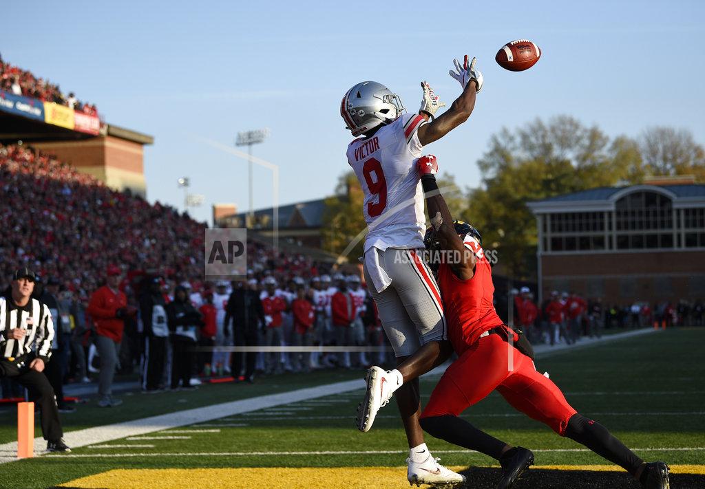 Nick Wass Ohio State wide receiver Binjimen Victor (9) reaches out to catch a touchdown against Maryland defensive back RaVon Davis, right, during the second half of an NCAA football game, Saturday, Nov. 17, 2018, in College Park, Md. Ohio State won 52-51 in overtime. (AP Photo/Nick Wass)