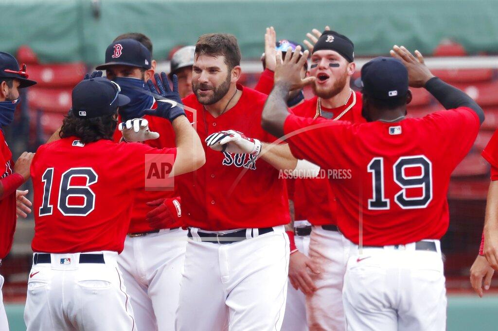 Michael Dwyer Boston Red Sox's Mitch Moreland, center, celebrates his two-run, walk-off home run during the ninth inning of a baseball game against the Toronto Blue Jays, Sunday, Aug. 9, 2020, in Boston. (AP Photo/Michael Dwyer)