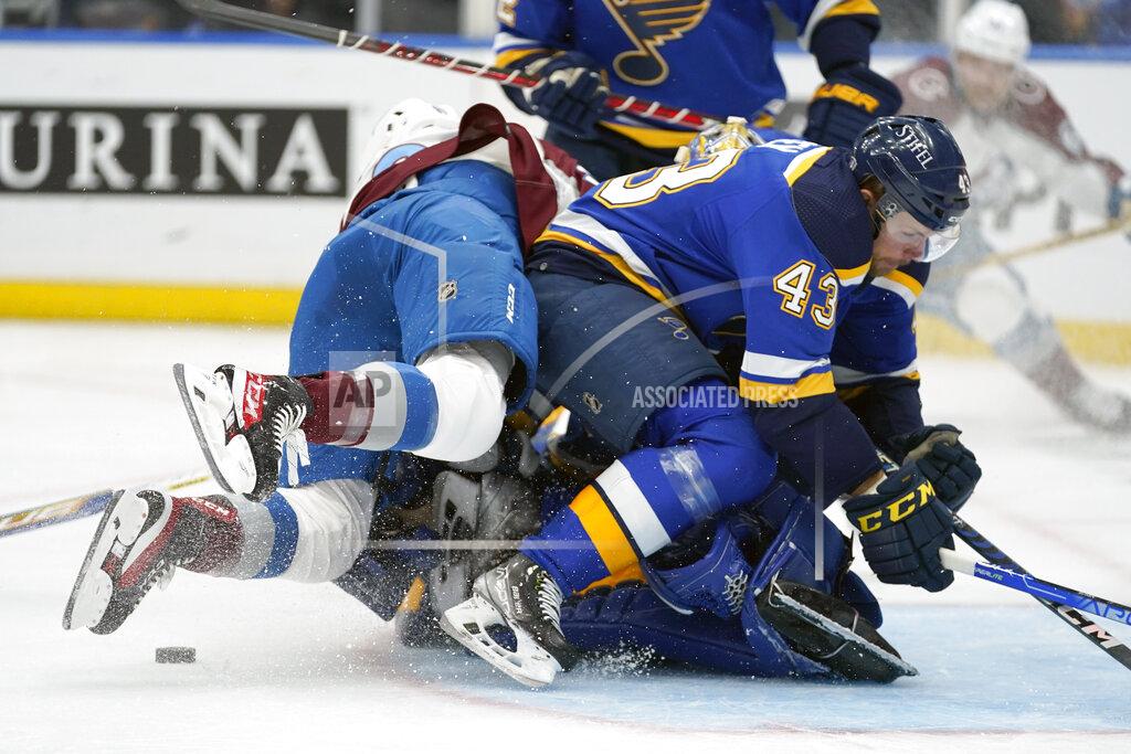 Jeff Roberson Colorado Avalanche's Nazem Kadri, left, falls on St. Louis Blues goaltender Jordan Binnington behind teammate Calle Rosen (43) during the first period in Game 3 of an NHL hockey Stanley Cup second-round playoff series Saturday, May 21, 2022, in St. Louis. Binnington was injured on the play and left the game. (AP Photo/Jeff Roberson)