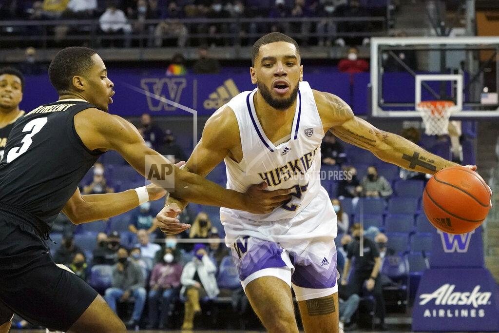 Ted S. Warren Washington guard Terrell Brown Jr., right, drives past Colorado guard Keeshawn Barthelemy, left, during the first half of an NCAA college basketball game, Thursday, Jan. 27, 2022, in Seattle. (AP Photo/Ted S. Warren)